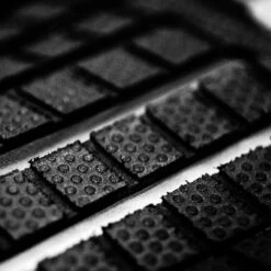 FCSII | FCS Julian Wilson Treadlite Tail Pad | Surfboard Deck Grip | Traction Pad | Charcoal Mango -FCS Shop Buy FCS Julian Wilson Treadlite Tail Pad Surf Shops Australia Online Closeup 47040.1698197498