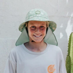 Plow Surf Co. | Gumnut Green Floral | Plow Surf Hat | Surfing Hat | Beach + Water Activity Headwear | -FCS Shop Buy Plow Surf Co Gumnut Green Floral Surfing Hat With Chin Strap Boys 83242.1692943844