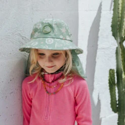 Plow Surf Co. | Gumnut Green Floral | Plow Surf Hat | Surfing Hat | Beach + Water Activity Headwear | -FCS Shop Buy Plow Surf Co Gumnut Green Floral Surfing Hat With Chin Strap Kids 13081.1692943756