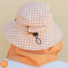 Plow Surf Co. | Orange Gingham | Plow Surf Hat | Surfing Hat | Beach + Water Activity Headwear | -FCS Shop Buy Plow Surf Co Orange Gingham Surfing Hat With Chin Strap Main 38224.1692946032